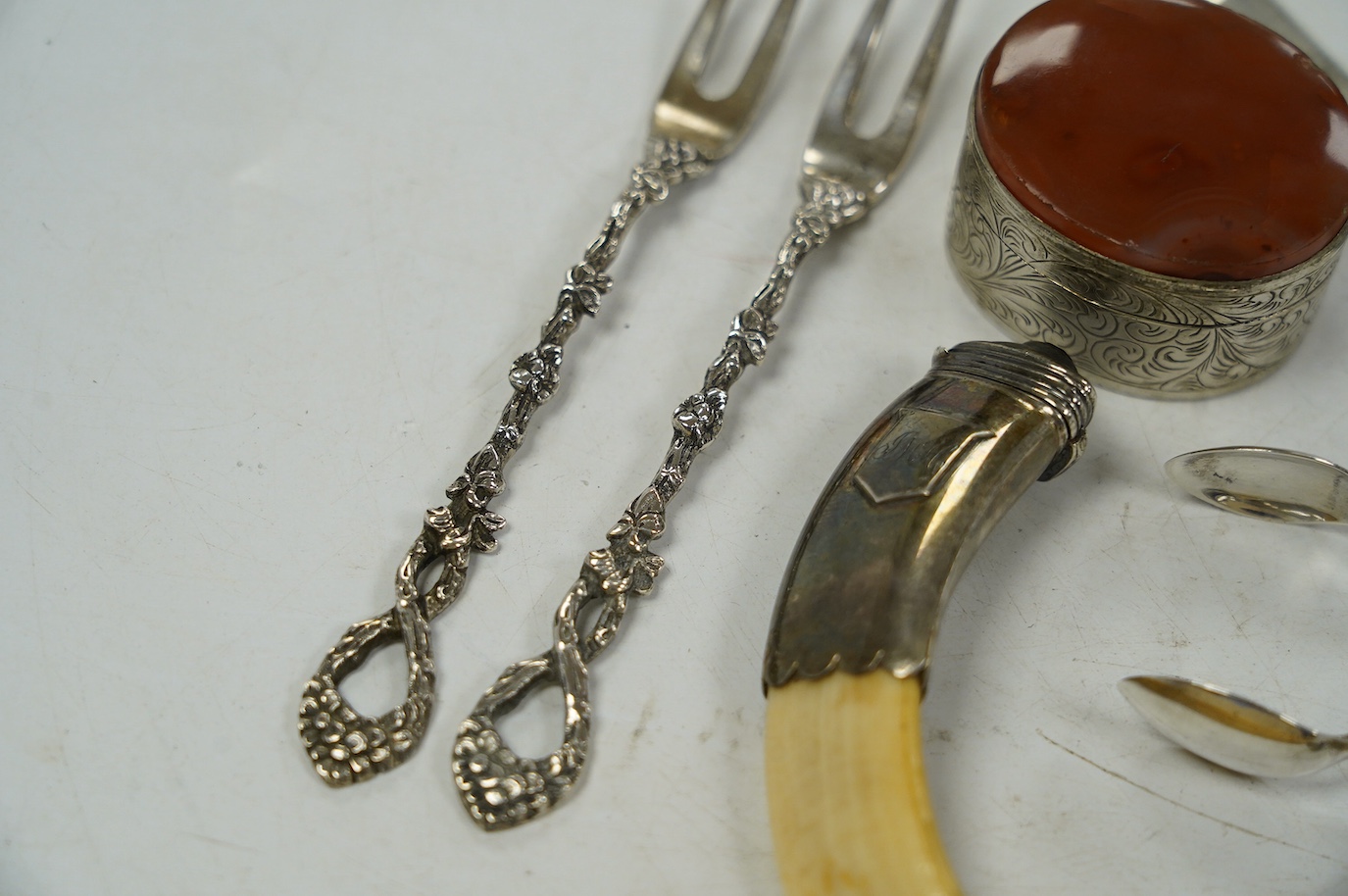 A 19th century white metal mounted tusk vinaigrette? (lacking grille), 11cm and a small quantity of 19th century and later silver cutlery, 10.4oz, including a cased christening trio and a Georg Jensen spoon and a box. Co